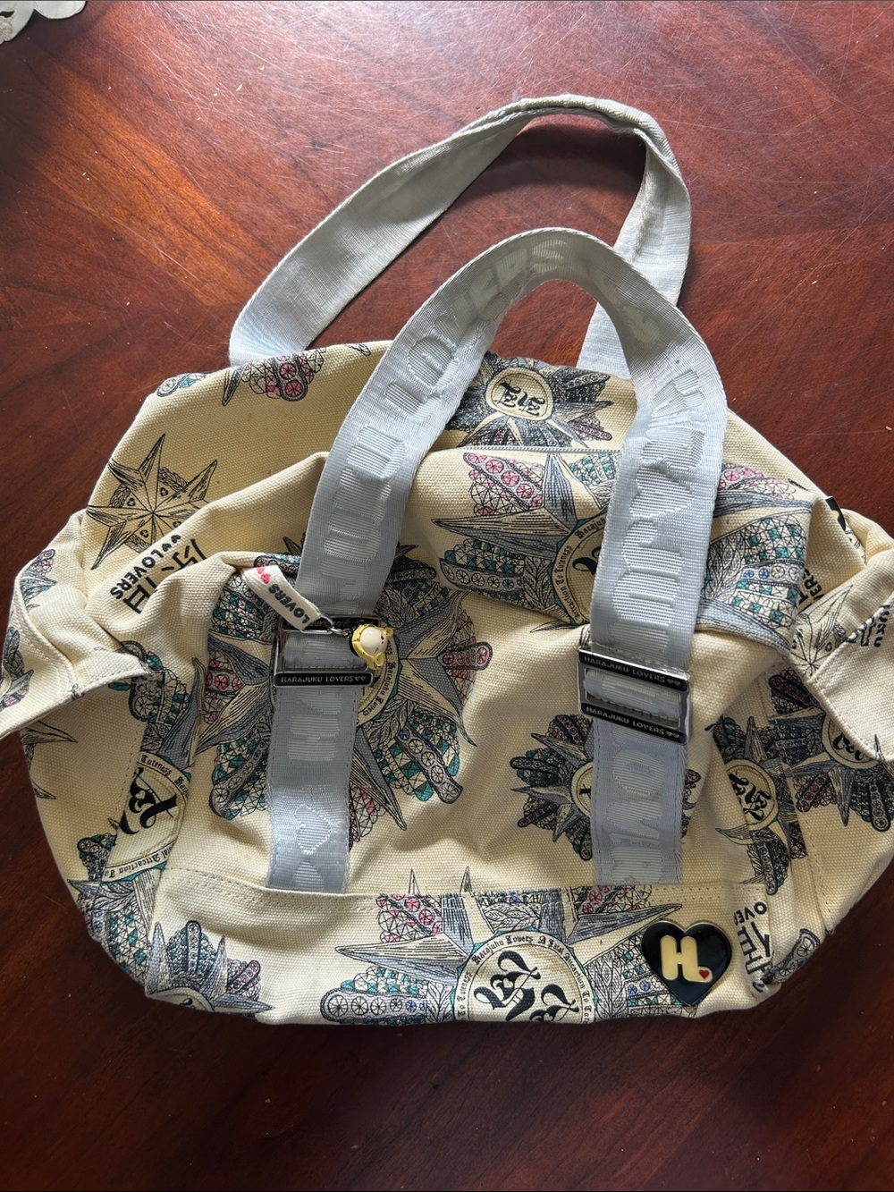 Harajuka Lovers Beige Canvas Tote with Multicolor Feather Motif